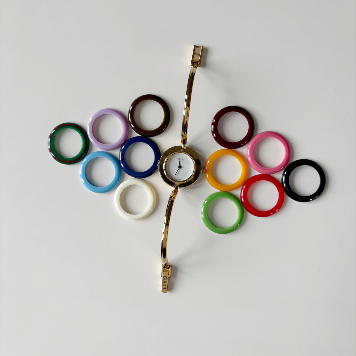 Gucci 1990s Interchangeable Bezel Gold Plated Bangle Watch with 12 bezels, case