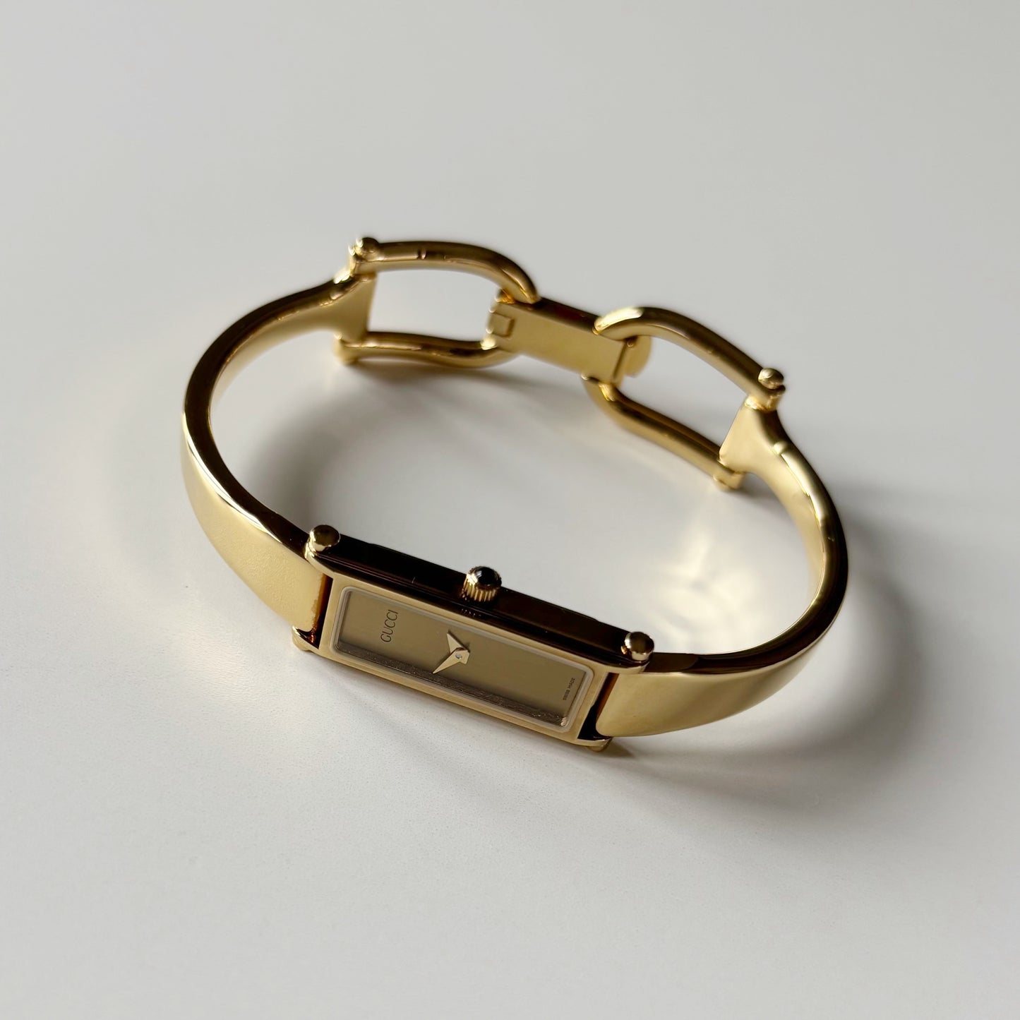 Gucci 1990s Gold Rectangular Dial Gold Plated Bangle Watch