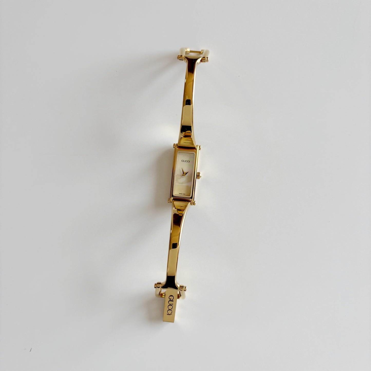 Gucci 1990s Seashell Rectangular Dial Gold Plated Bangle Watch