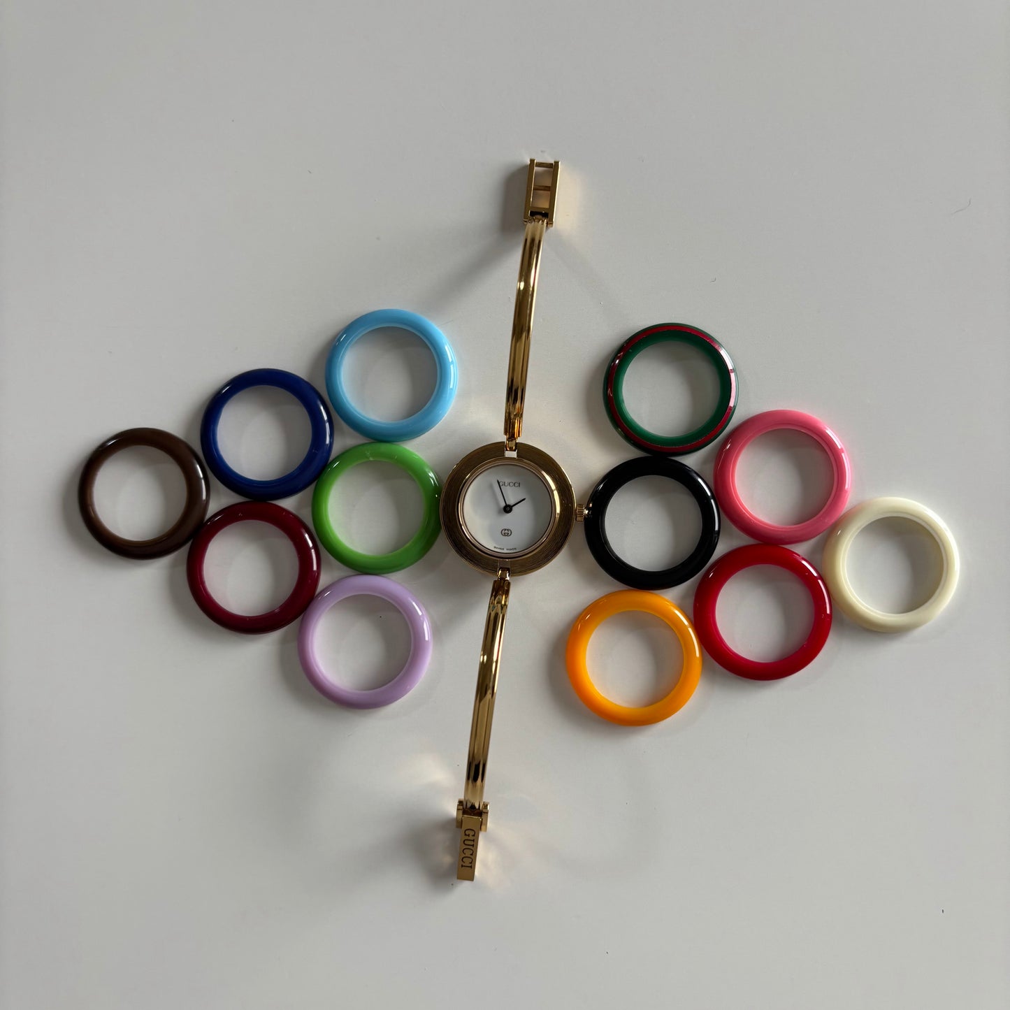 Gucci 1990s Interchangeable Bezel Gold Plated Bangle Watch with 12 bezels, case (Small)