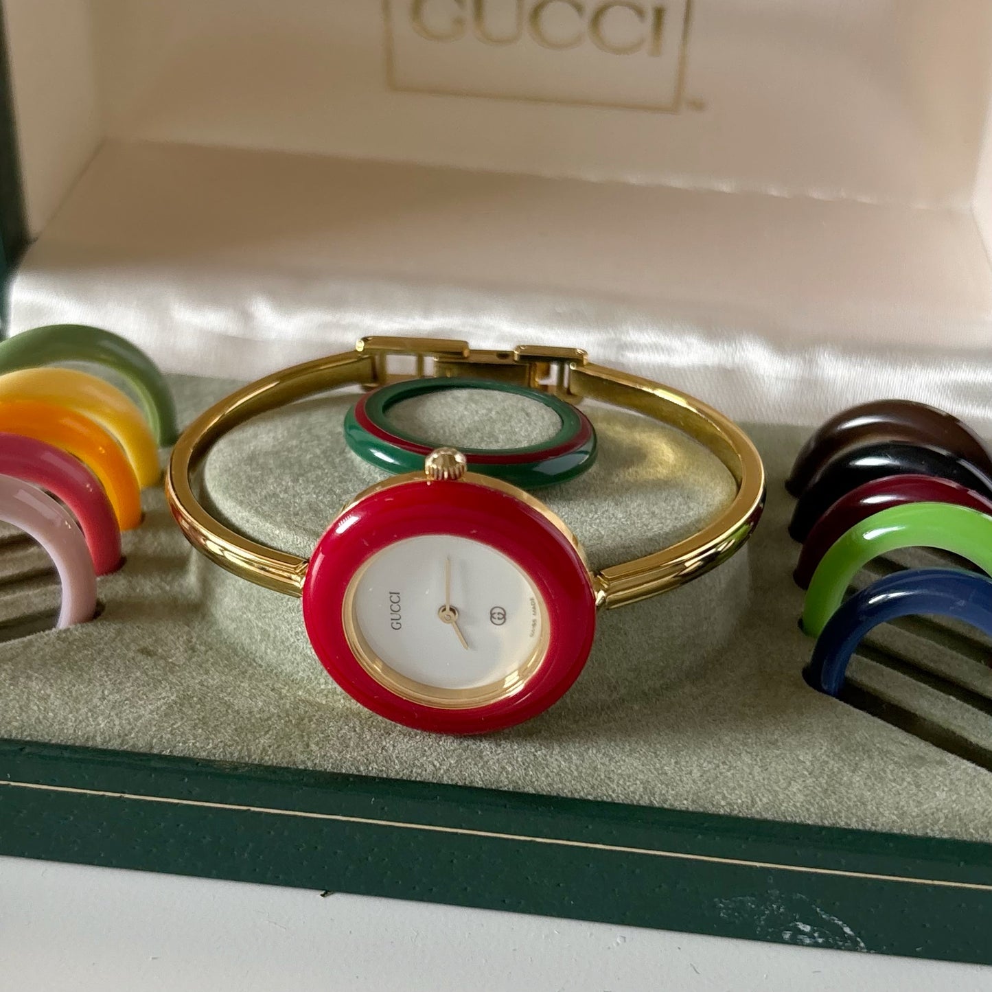 Gucci 1990s Interchangeable Bezel Gold Plated Bangle Watch with 12 bezels, case