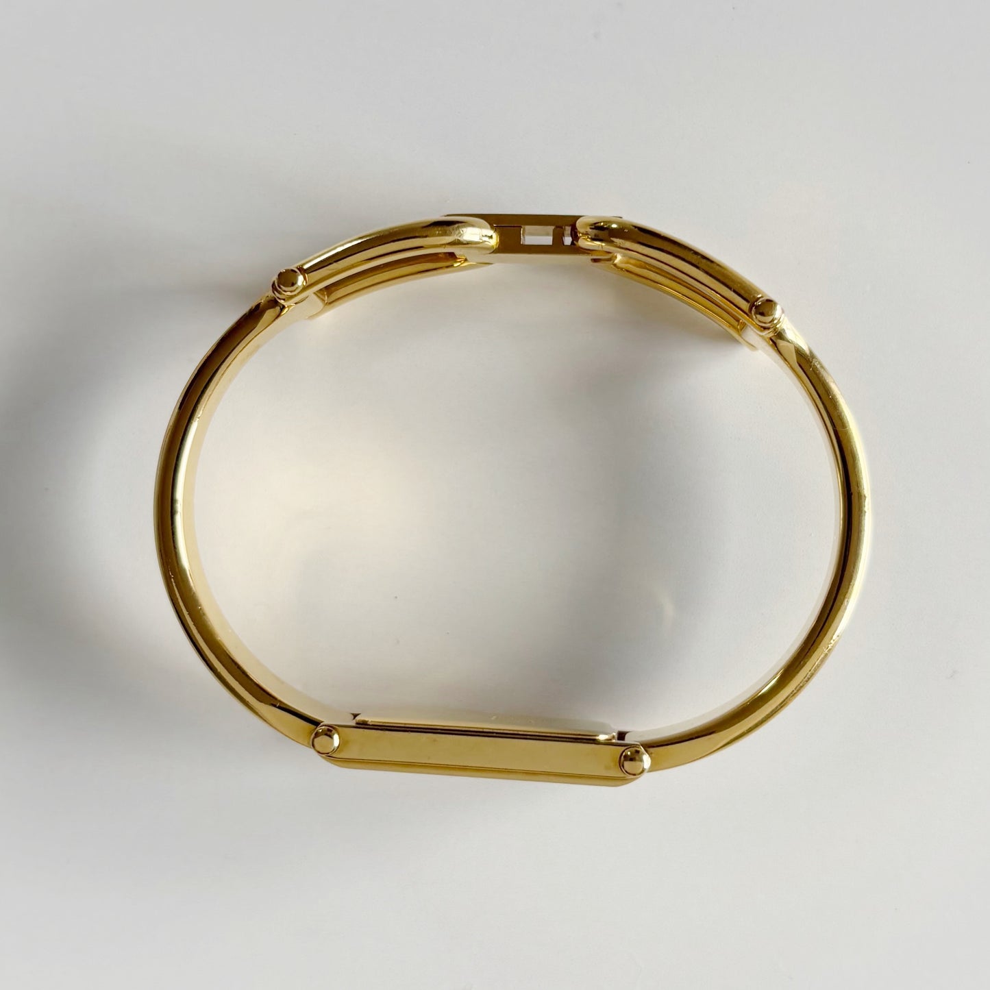 Gucci 1990s Gold Rectangular Dial Gold Plated Bangle Watch