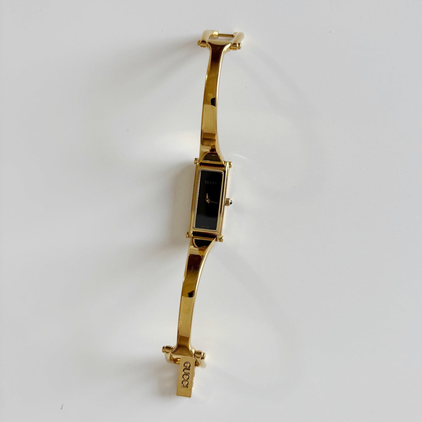 Gucci 1990s Black Dial Rectangular Gold Plated Bangle Watch