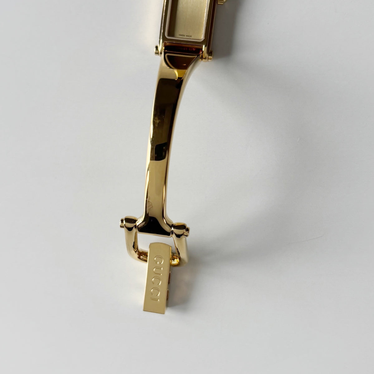 Gucci 1990s Gold Rectangular Dial Gold Plated Bangle Watch