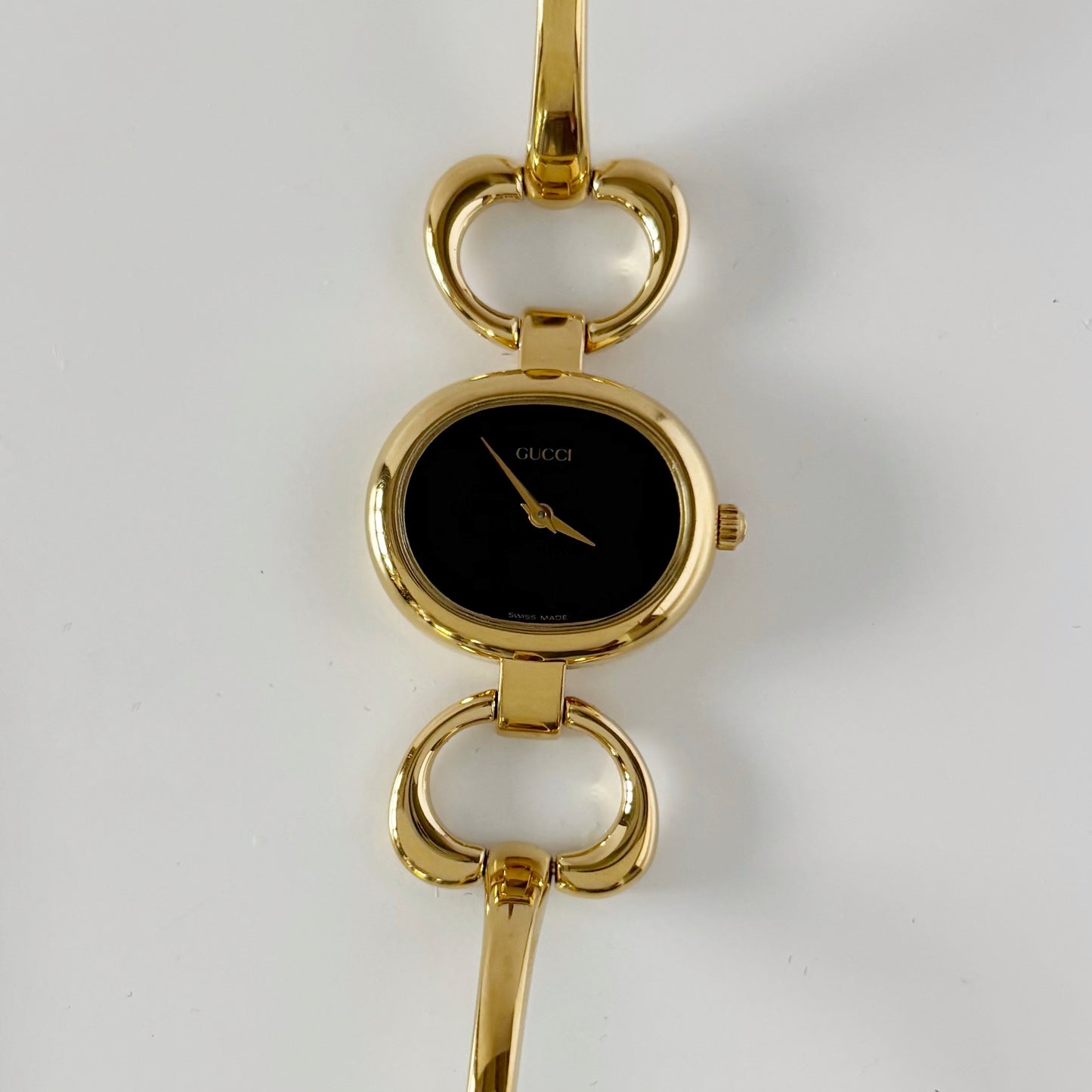 Gucci 1990s Black Oval Dial Gold Plated Bangle Watch