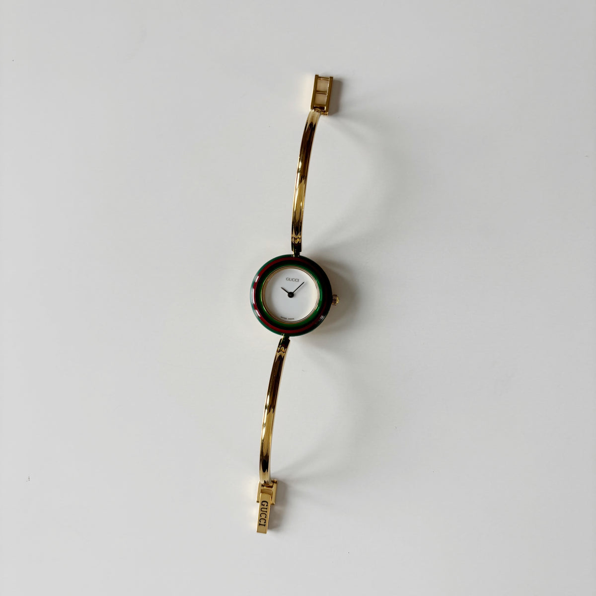Gucci 1990s Interchangeable Bezel Gold Plated Bangle Watch with 12 bezels, case