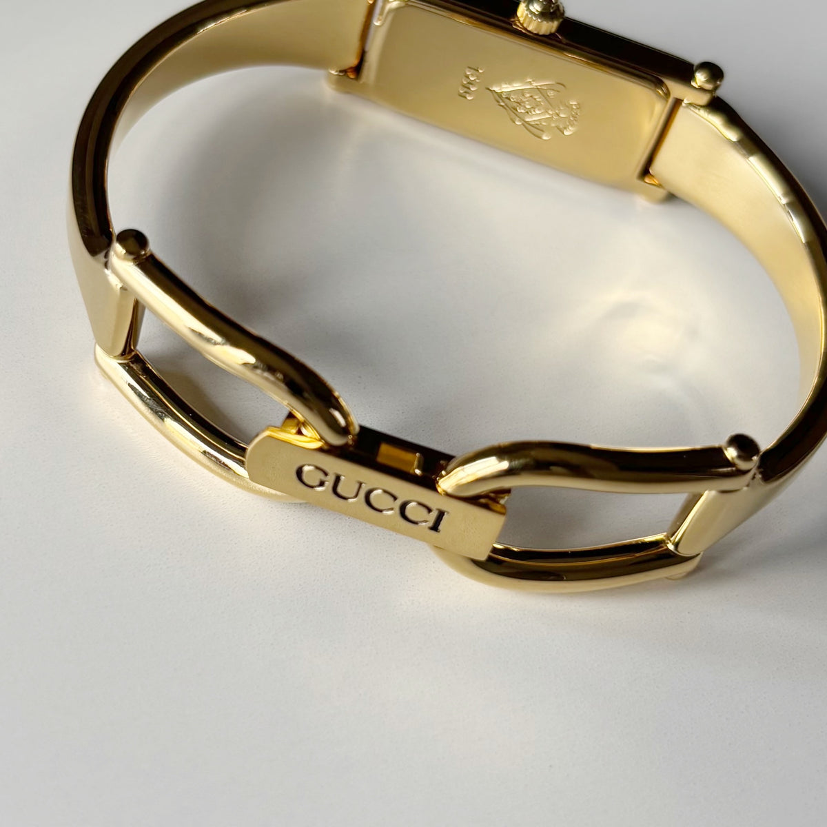 Gucci 1990s Rectangular Gold Dial Gold Plated Bangle Watch (Small)