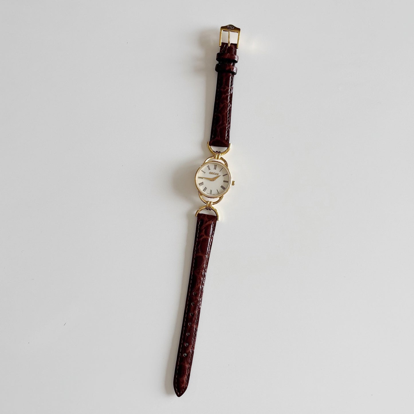 Gucci 1990s Round Dial Gold Plated Horsebit Watch