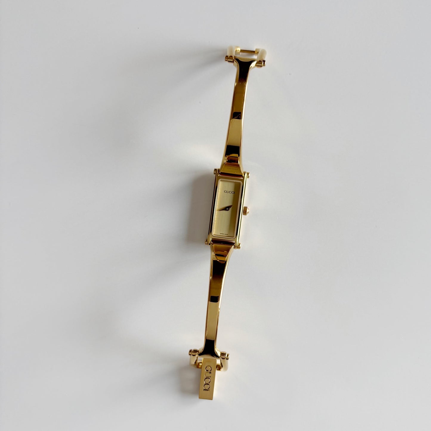 Gucci 1990s Gold Dial Rectangular Gold Plated Bangle Watch
