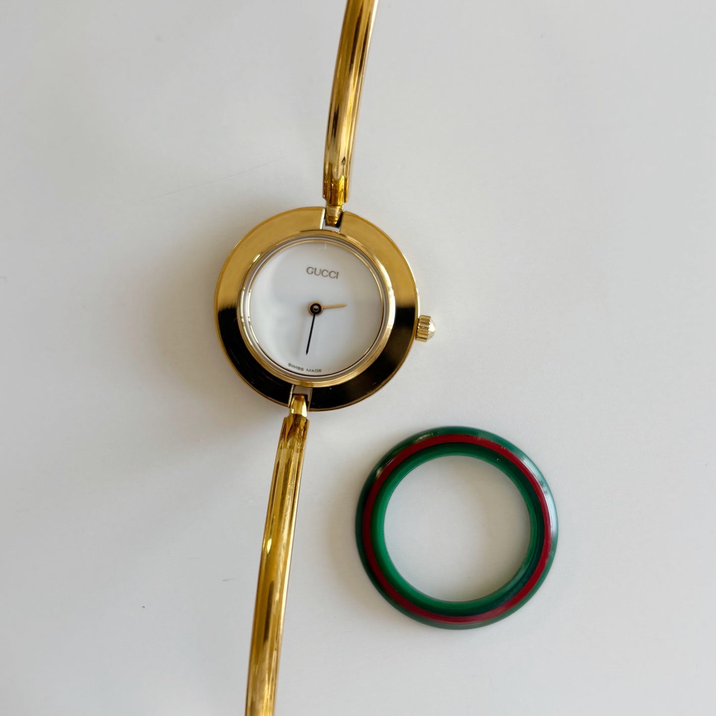 Gucci 1990s Interchangeable Bezel Gold Plated Bangle Watch with 12 bezels, case