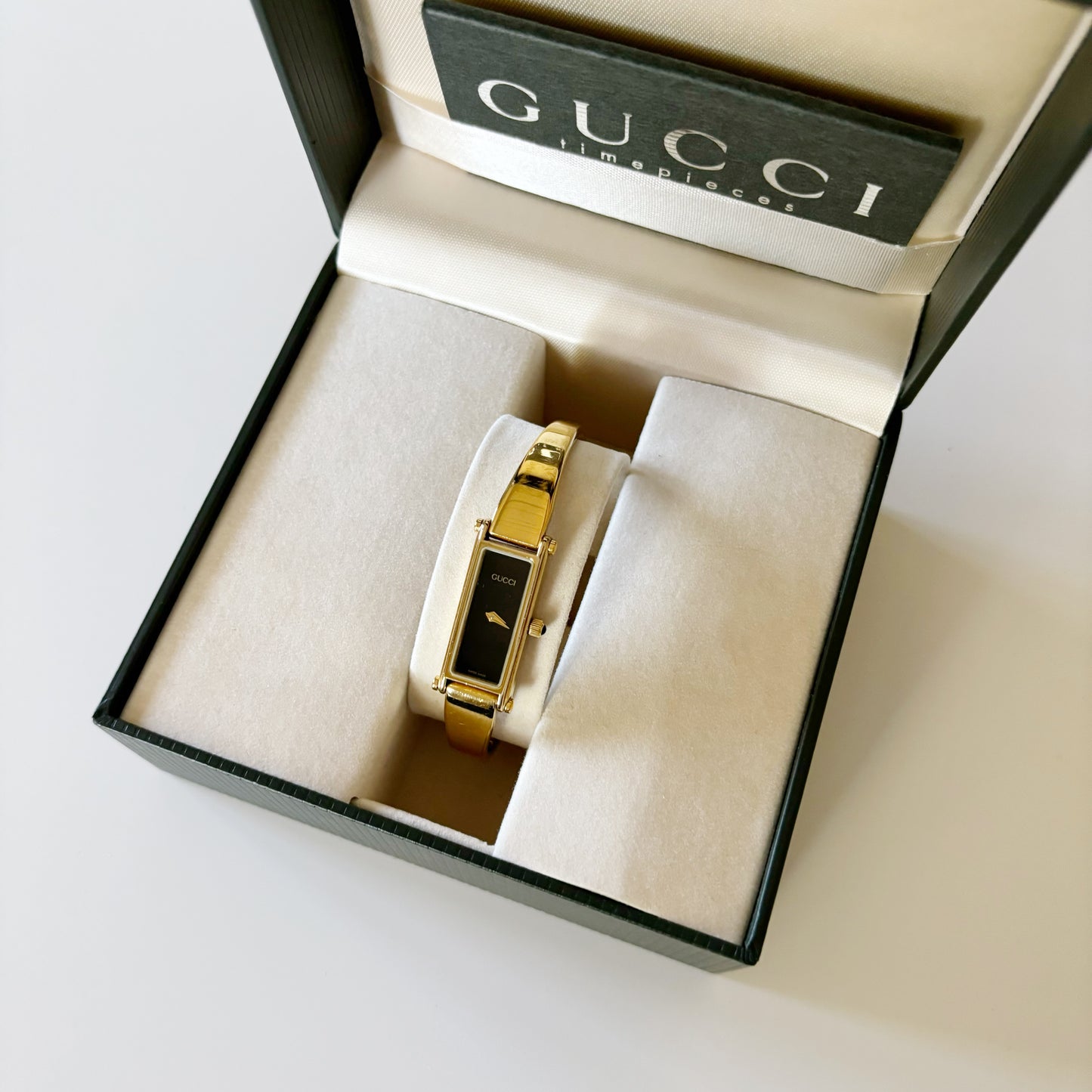 Gucci 1990s Rectangular Black Dial Gold Plated Bangle Watch