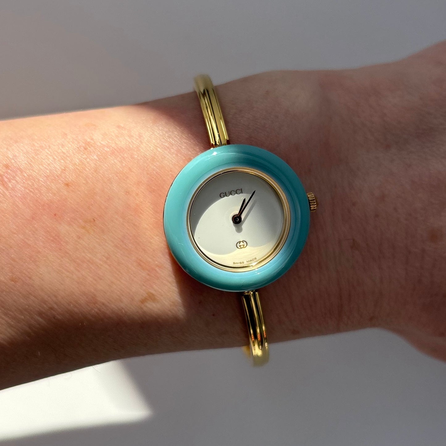 Gucci 1990s Interchangeable Bezel Gold Plated Bangle Watch with 12 bezels, case