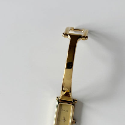 Gucci 1990s Gold Rectangular Dial Gold Plated Bangle Watch