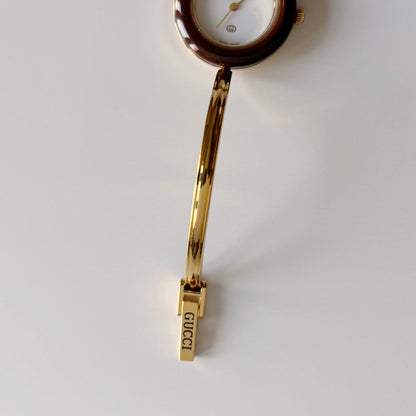 Gucci 1990s Interchangeable Bezel Gold Plated Bangle Watch with 12 bezels, case