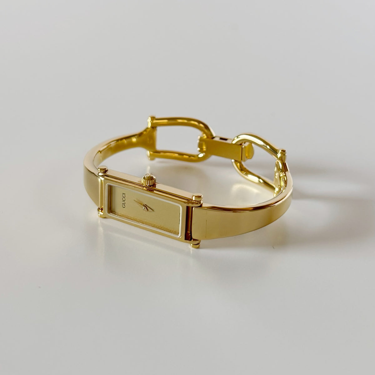 Gucci 1990s Rectangular Gold Dial Gold Plated Bangle Watch (Small)