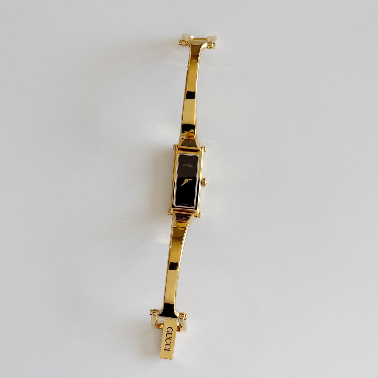 Gucci 1990s Black Rectangular Dial Gold Plated Bangle Watch