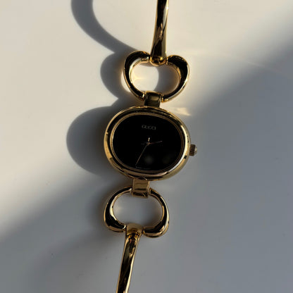 Gucci 1990s Oval Black Dial Gold Plated Bangle Watch (Small)