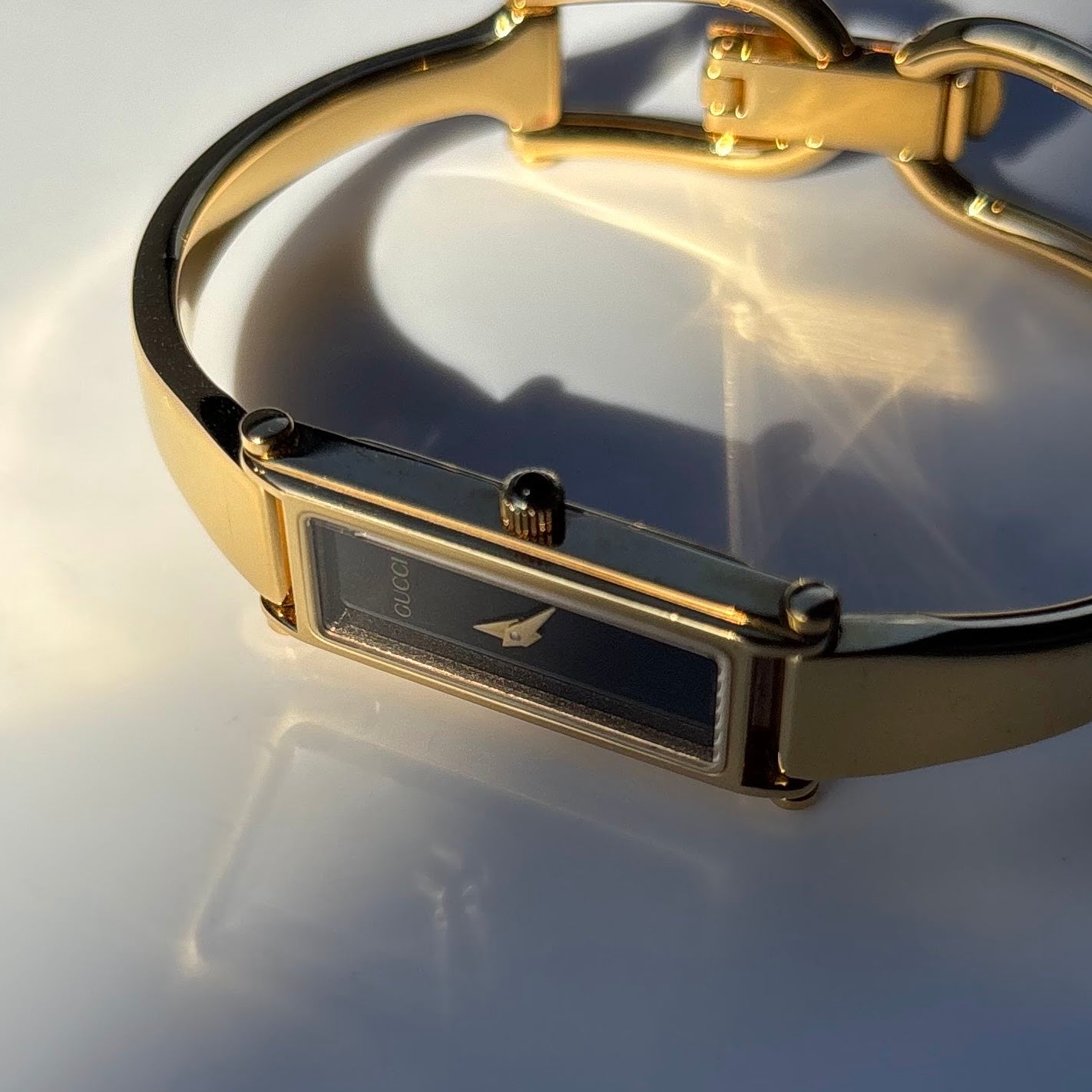 Gucci 1990s Black Dial Rectangular Gold Plated Bangle Watch