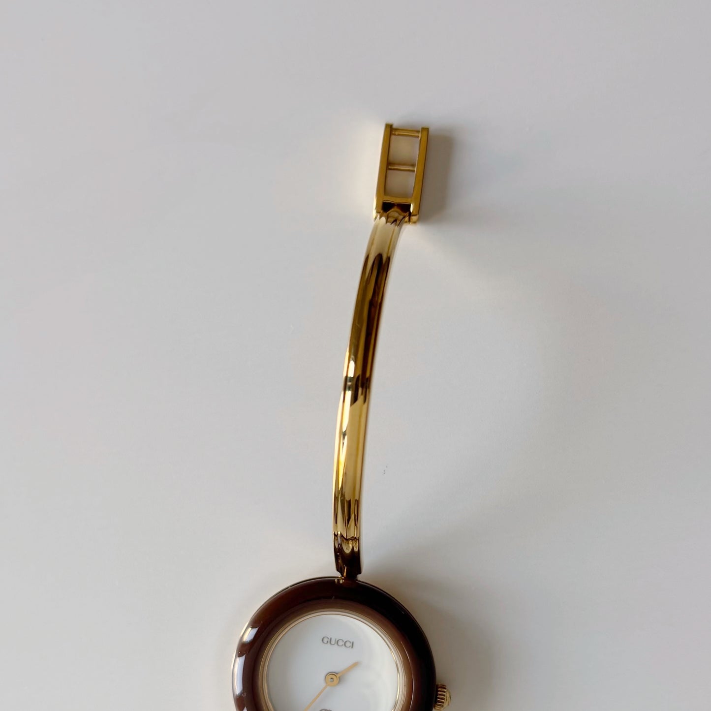 Gucci 1990s Interchangeable Bezel Gold Plated Bangle Watch with 12 bezels, case