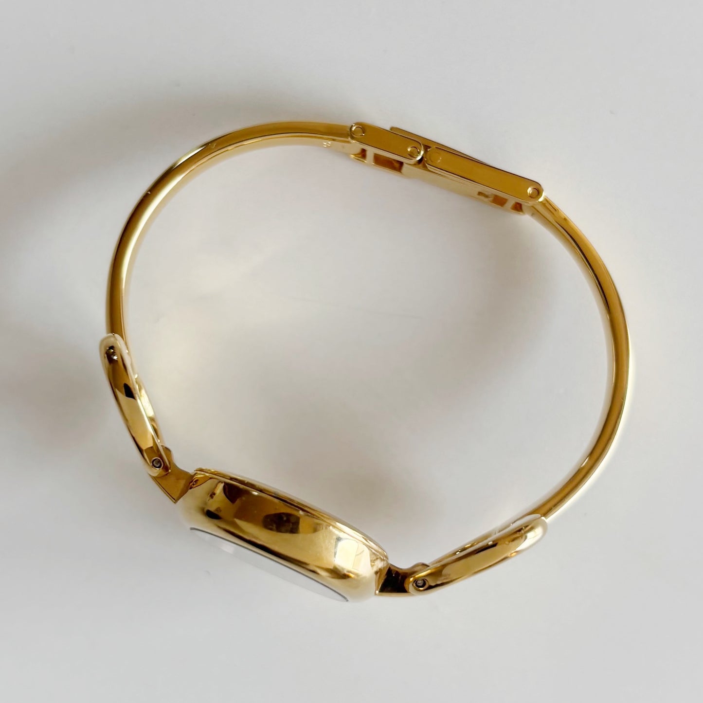 Gucci 1990s Oval Black Dial Gold Plated Bangle Watch (Small)