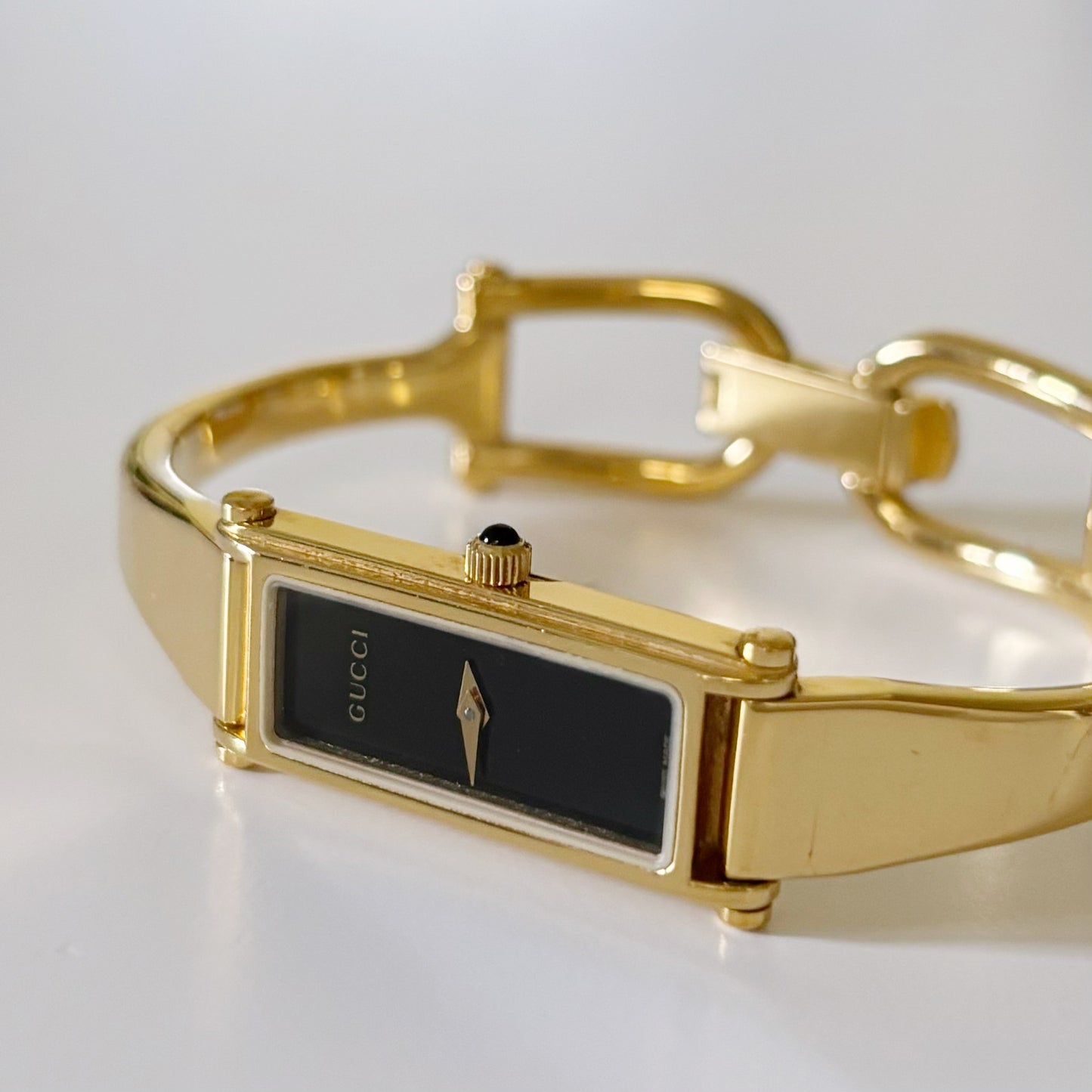 Gucci 1990s Black Dial Rectangular Gold Plated Bangle Watch