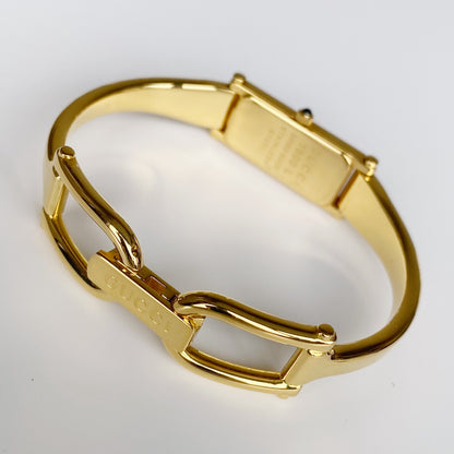 Gucci 1990s Black Dial Rectangular Gold Plated Bangle Watch