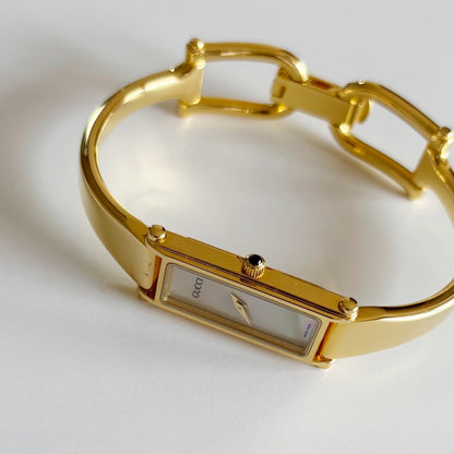 Gucci 1990s Seashell Dial Rectangular Gold Plated Bangle Watch