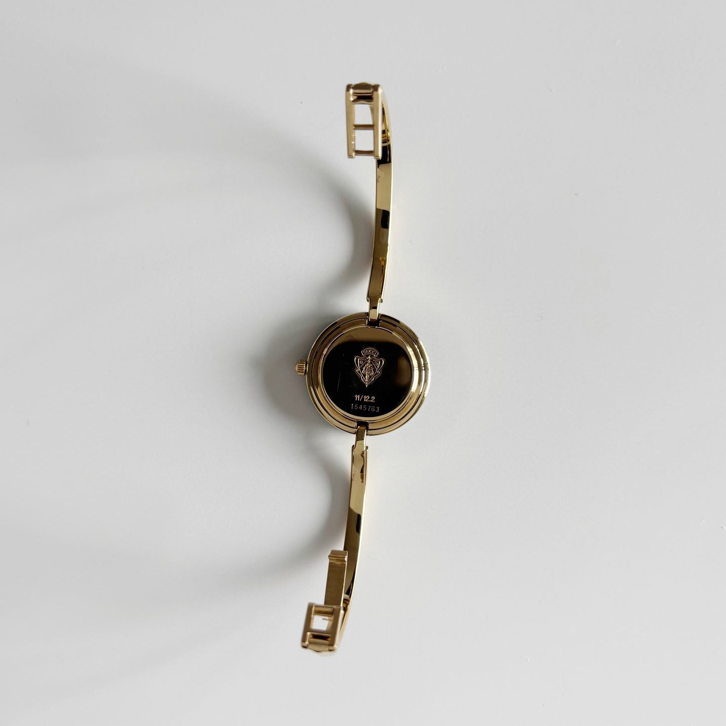 Gucci 1990s Interchangeable Bezel Gold Plated Bangle Watch with 12 bezels, case