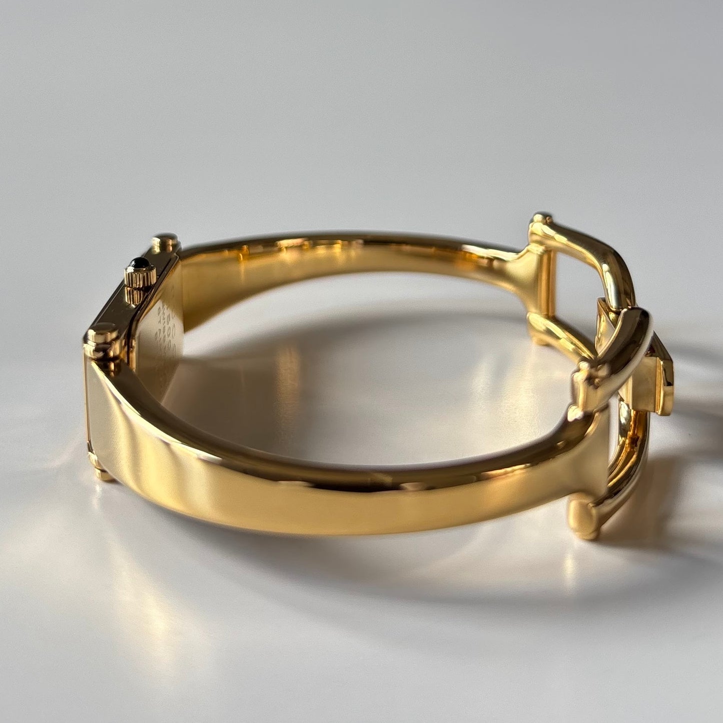Gucci 1990s Black Rectangular Dial Gold Plated Bangle Watch