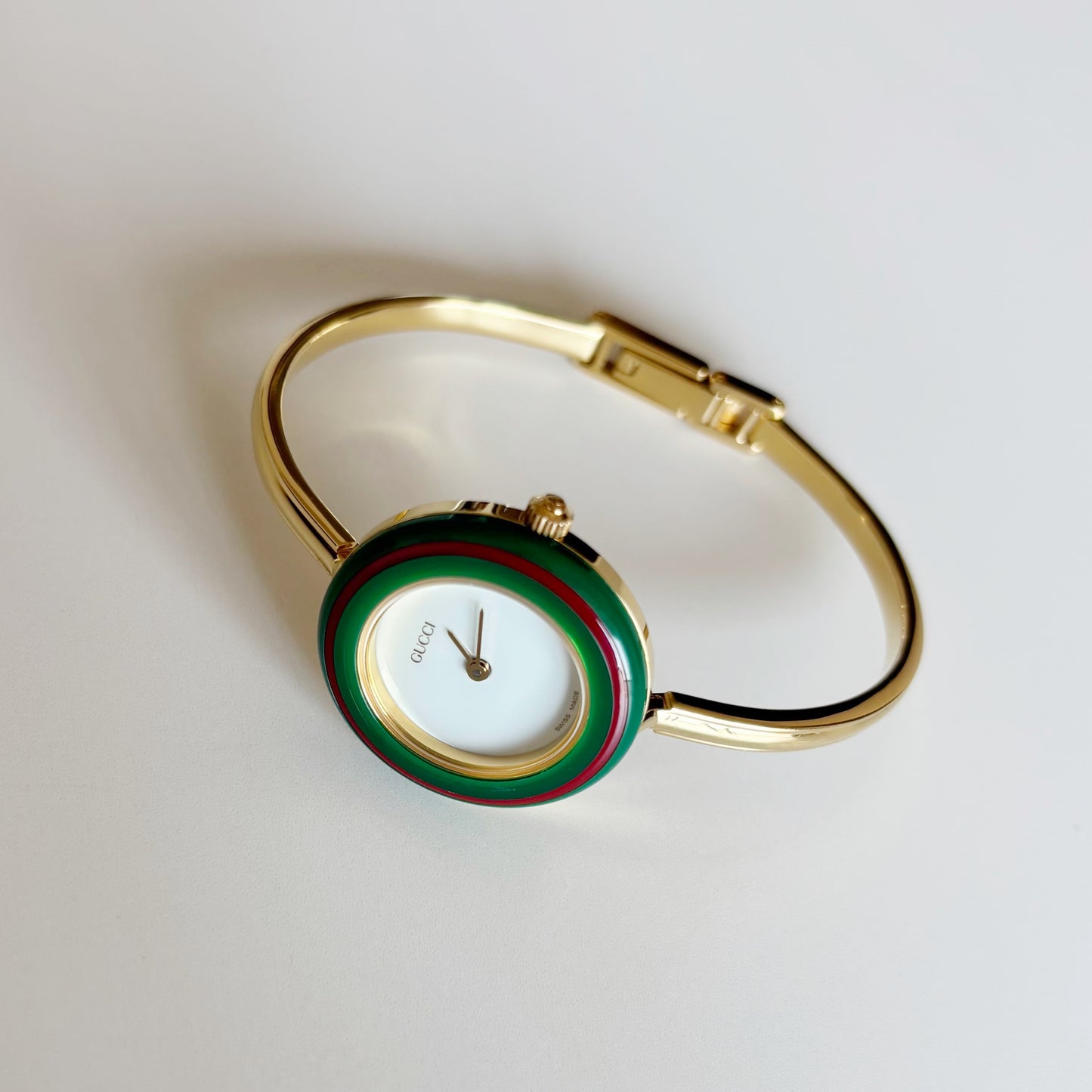 Gucci 1990s Interchangeable Bezel Gold Plated Bangle Watch with 12 bezels, case