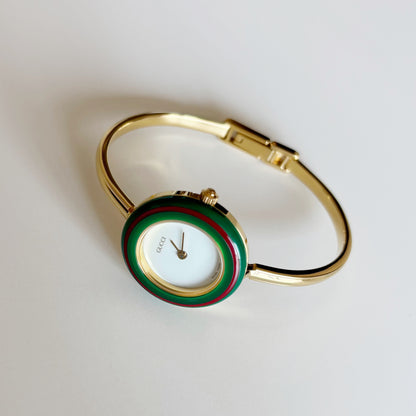 Gucci 1990s Interchangeable Bezel Gold Plated Bangle Watch with 12 bezels, case