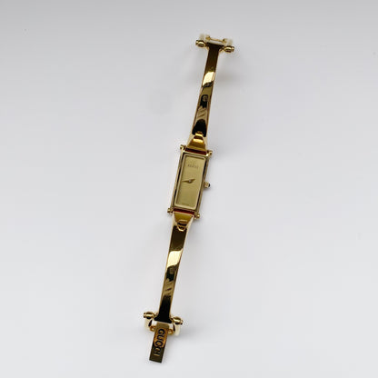 Gucci 1990s Gold Dial Gold Plated Rectangular Bangle Watch