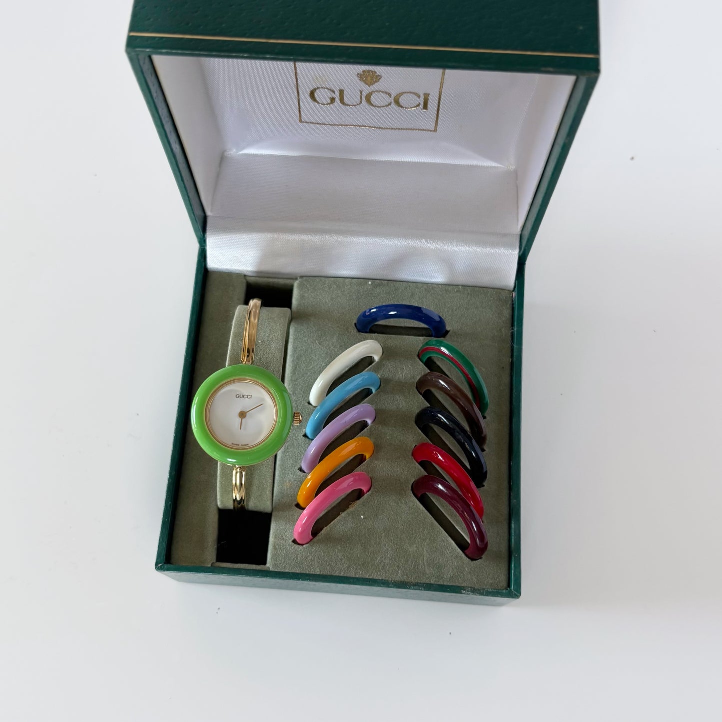 Gucci 1990s Interchangeable Bezel Gold Plated Bangle Watch with 12 bezels, case