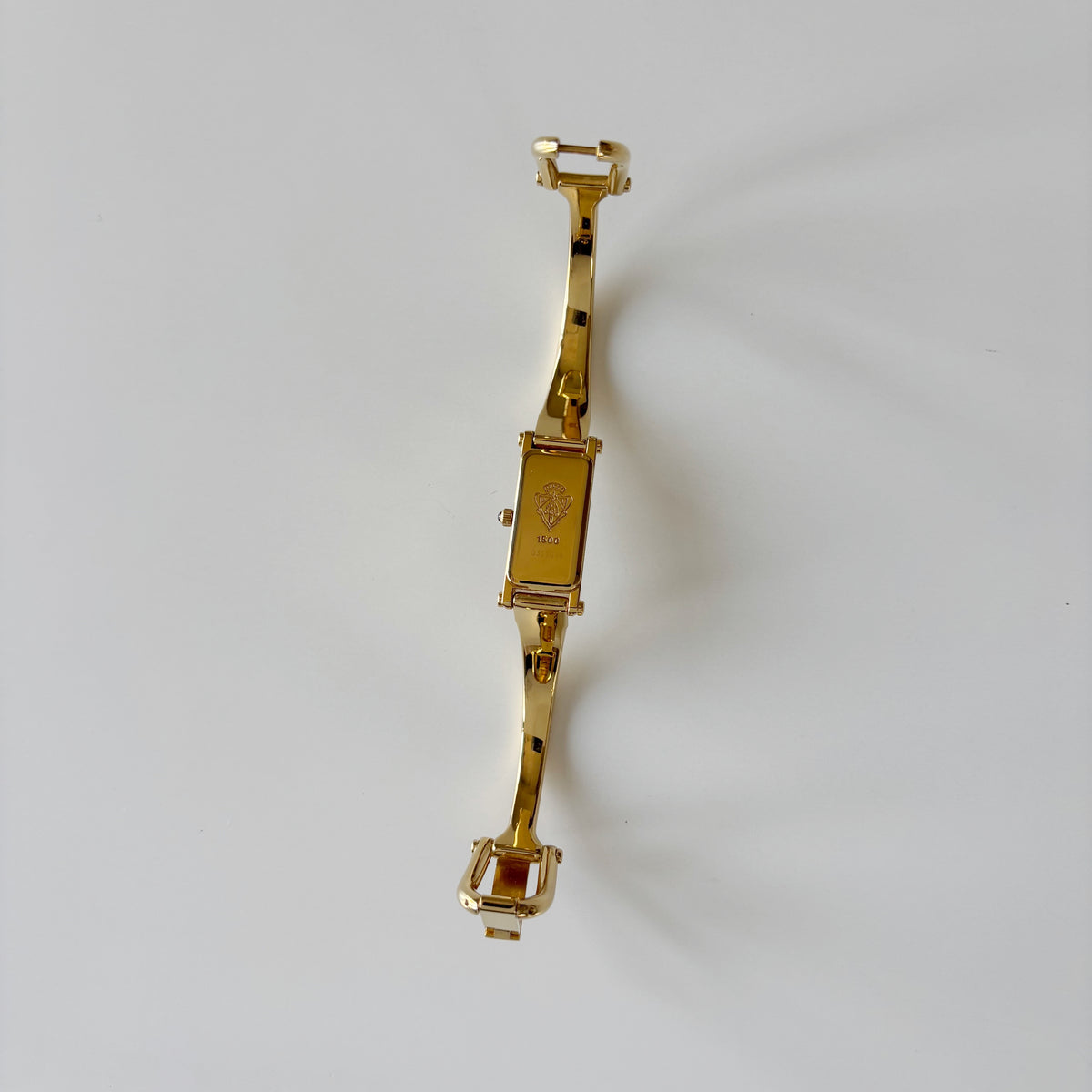 Gucci 1990s Rectangular Gold Dial Gold Plated Bangle Watch