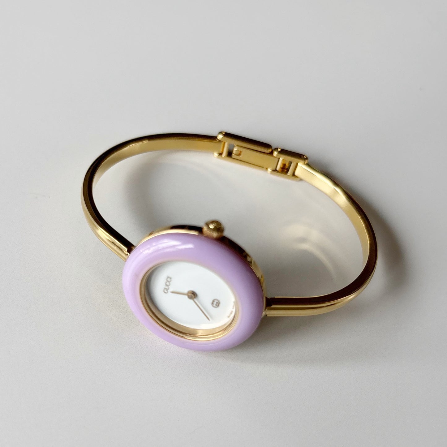 Gucci 1990s Interchangeable Bezel Gold Plated Bangle Watch with 12 bezels, case