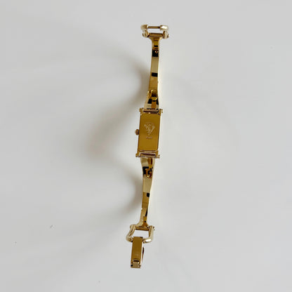 Gucci 1990s Cream Dial Rectangular Gold Plated Bangle Watch