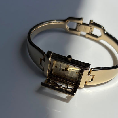 Yves Saint Laurent 1990s Peek-A-Boo Gold Plated Bangle Watch