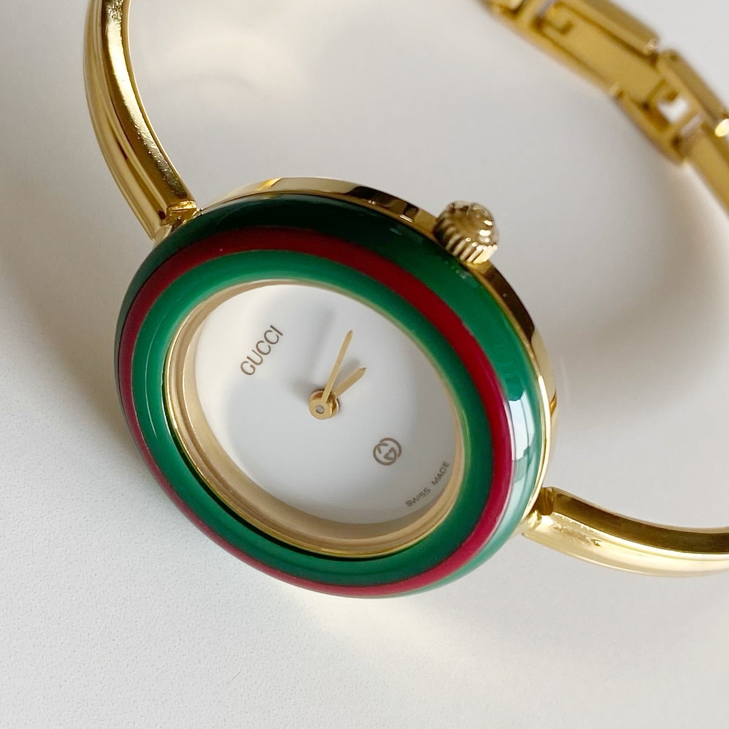 Gucci 1990s Interchangeable Bezel Gold Plated Bangle Watch with 12 bezels, case