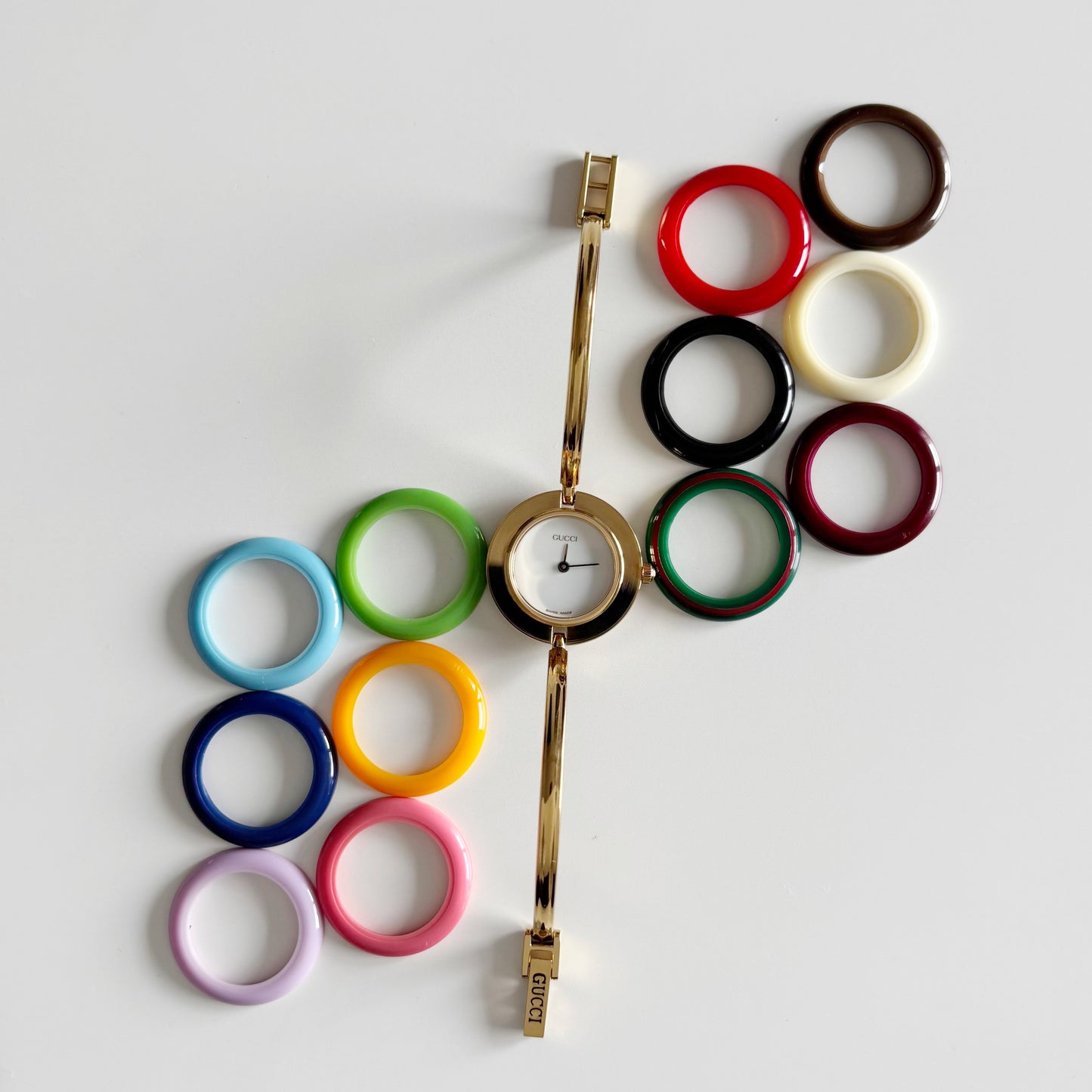 Gucci 1990s Interchangeable Bezel Gold Plated Bangle Watch with 12 bezels, case