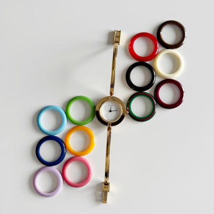 Gucci 1990s Interchangeable Bezel Gold Plated Bangle Watch with 12 bezels, case