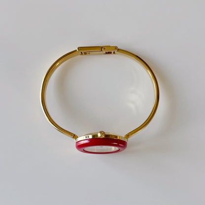 Gucci 1990s Interchangeable Bezel Gold Plated Bangle Watch with 12 bezels, case