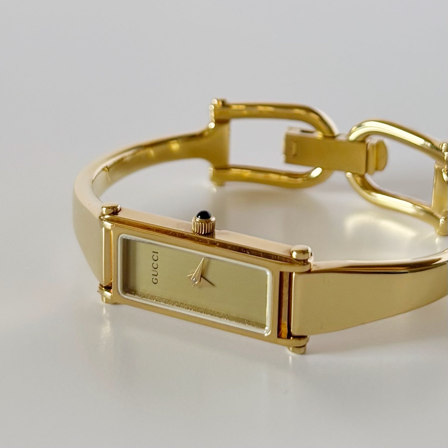 Gucci 1990s Gold Rectangular Dial Gold Plated Bangle Watch (Small)