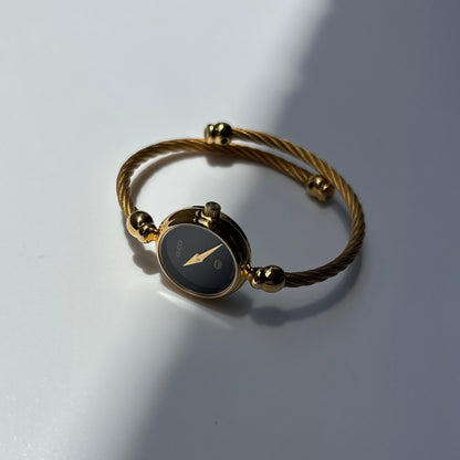 Gucci 1990s Black Round Dial Cable Gold Plated Bangle Watch
