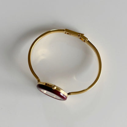 Gucci 1990s Interchangeable Bezel Gold Plated Bangle Watch with 12 bezels, case
