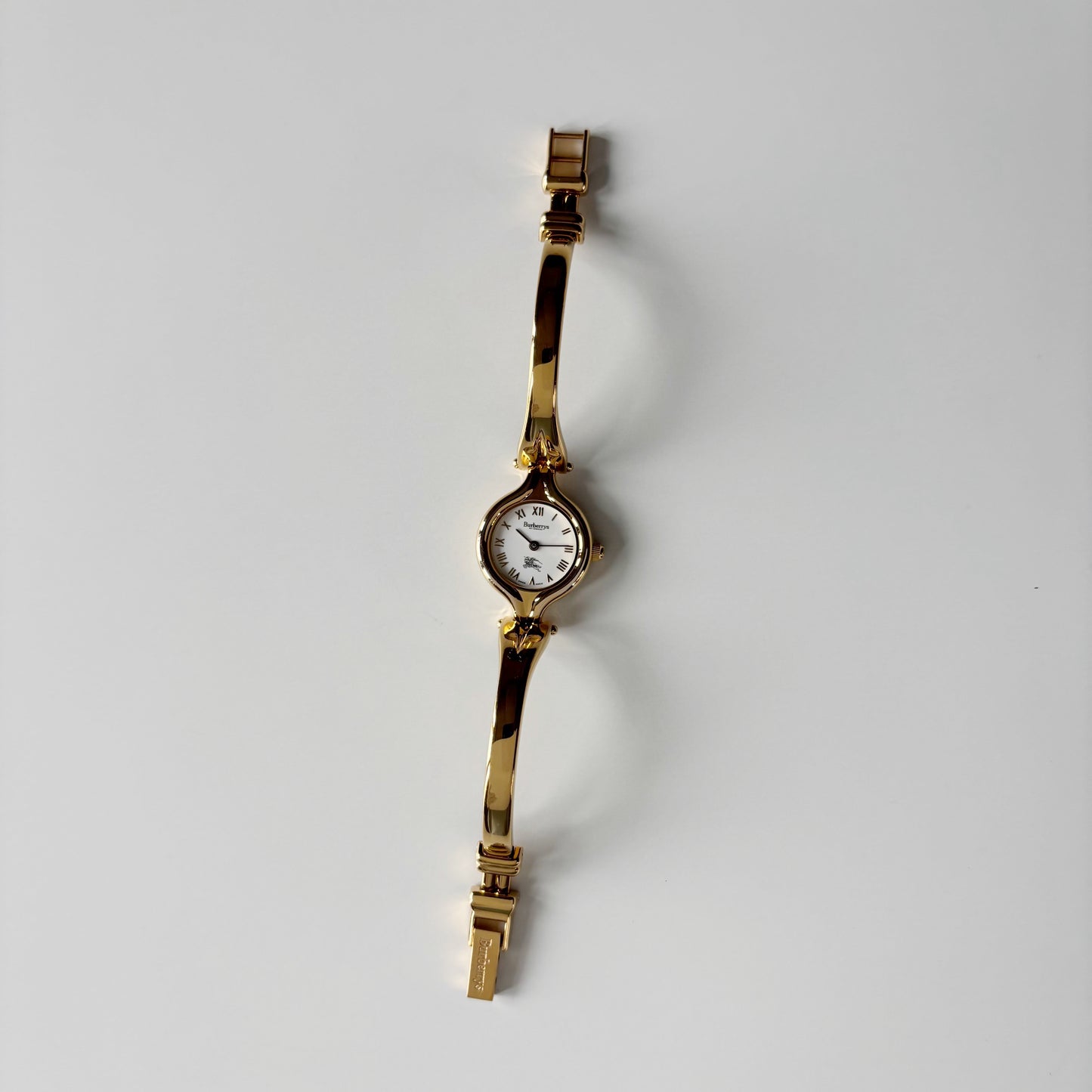 Burberry 1990s Round Dial Gold Plated Bangle Watch