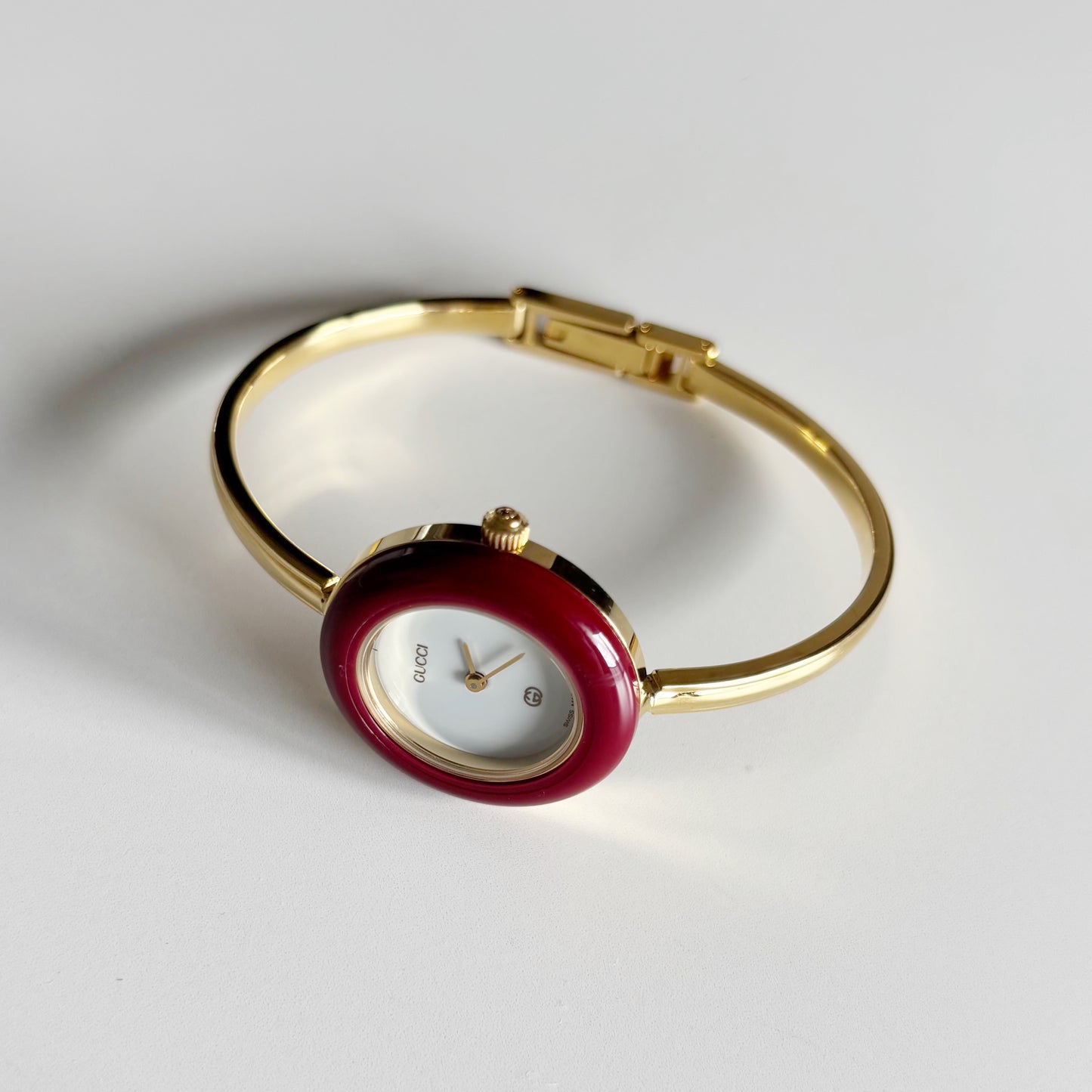 Gucci 1990s Interchangeable Bezel Gold Plated Bangle Watch with 12 bezels, case