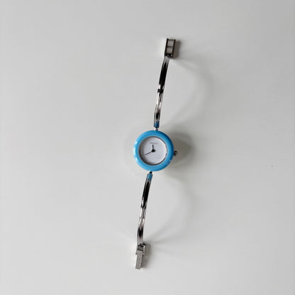 Gucci 1990s Interchangeable Bezel Silver Stainless steel Bangle Watch with 12 bezels, case