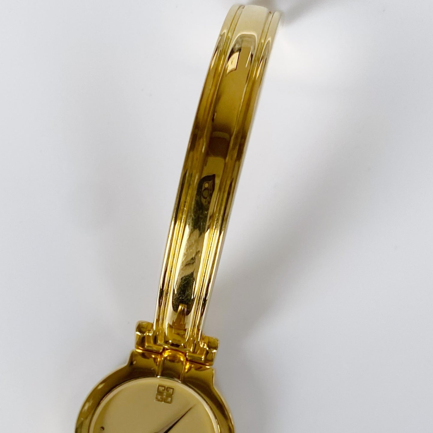 Givenchy 1990s Gold Plated Round Bangle Watch