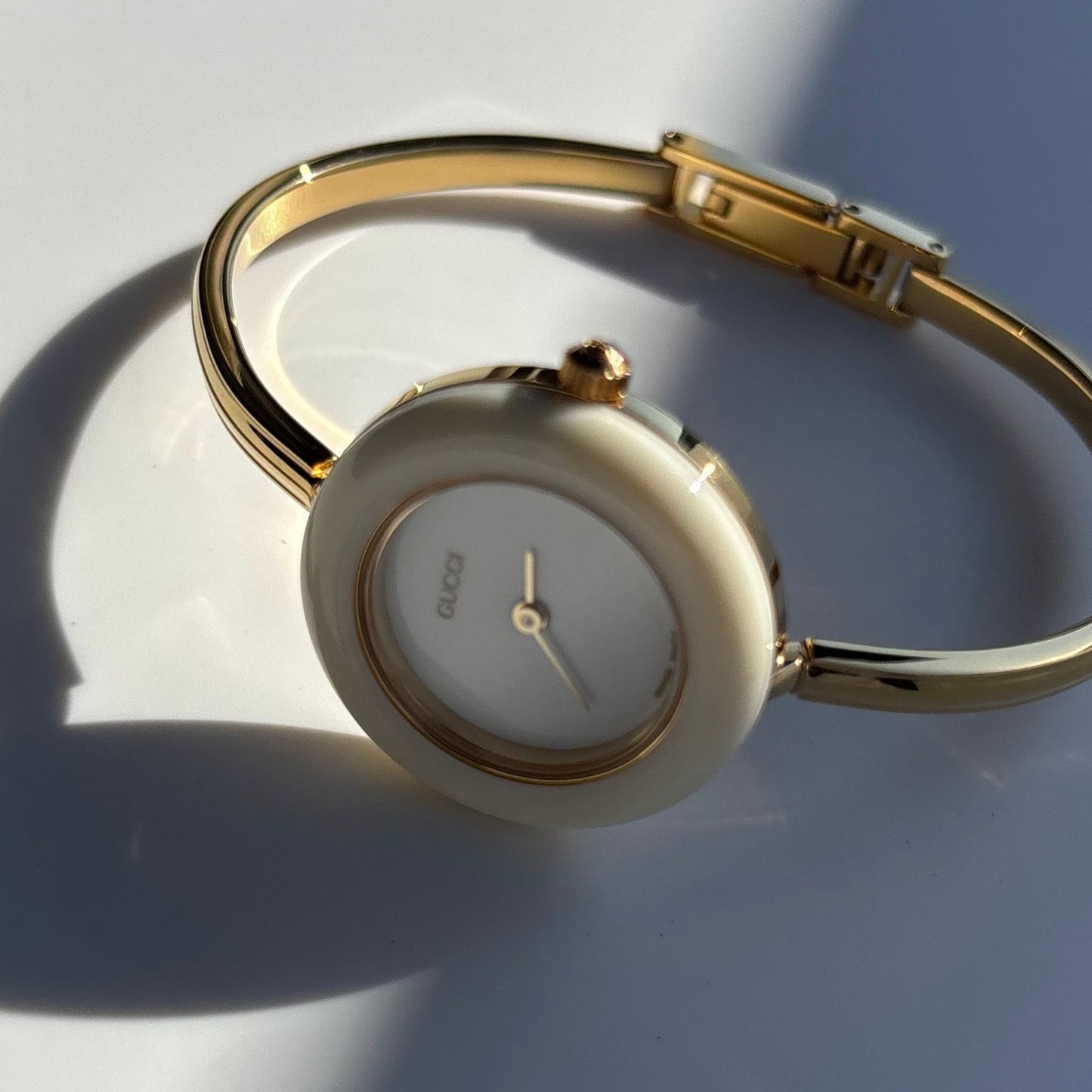 Gucci 1990s Interchangeable Bezel Gold Plated Bangle Watch with 12 bezels, case