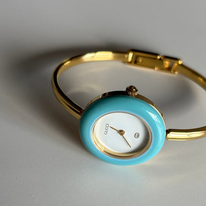 Gucci 1990s Interchangeable Bezel Gold Plated Bangle Watch with 12 bezels, case
